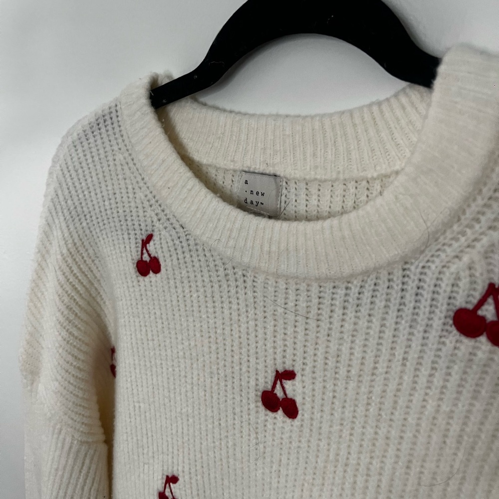 a new day Cream Sweater with Red Cherry Accents
